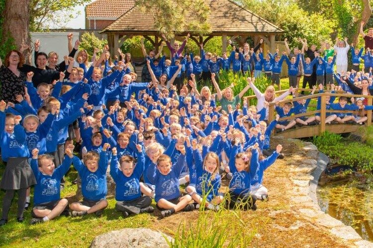 Pupils at Lymington Infants School celebrating Ofsted report
